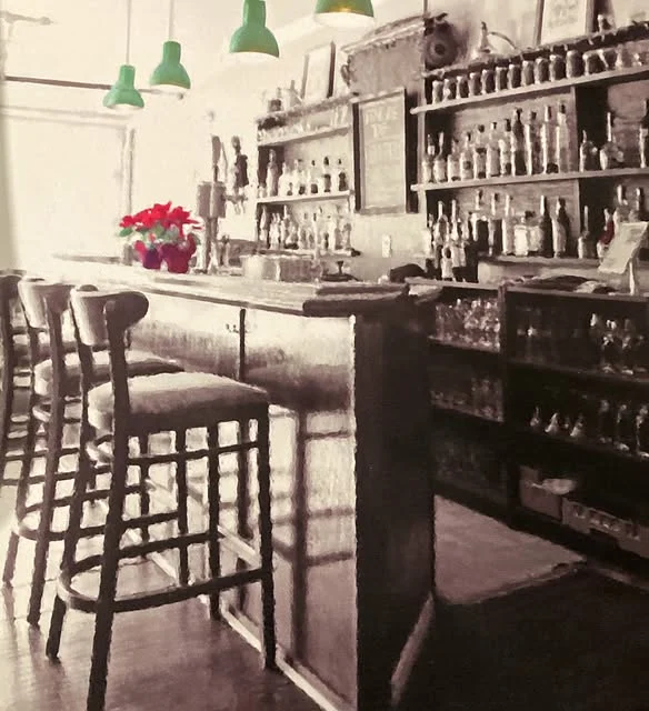 The bar and high stools inside The Beech Tree