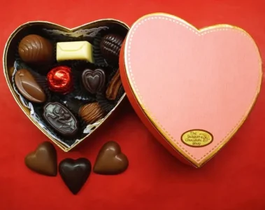 Assorted chocolates in an open heart-shaped gift box
