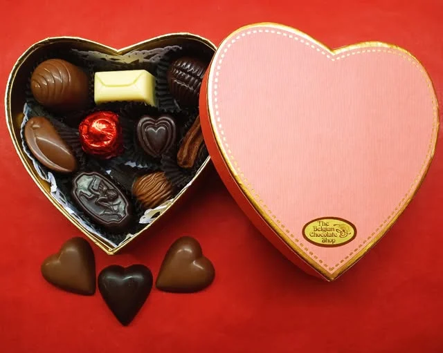 Assorted chocolates in an open heart-shaped gift box
