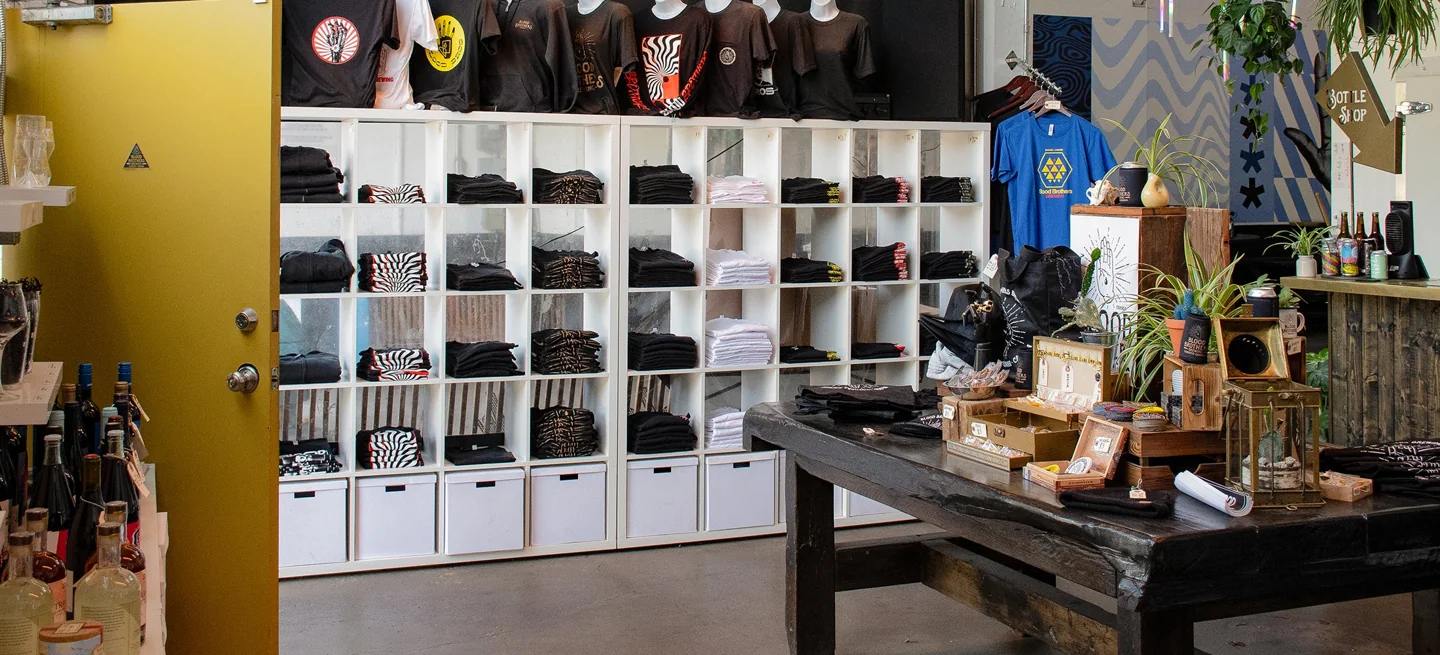 Merchandise shelves and a counter inside the Blood Brothers bottle shop