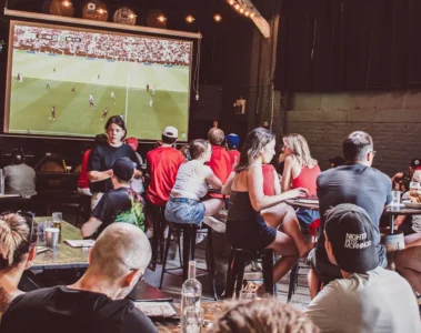 Friends gathered around tables in the Blood Brothers taproom