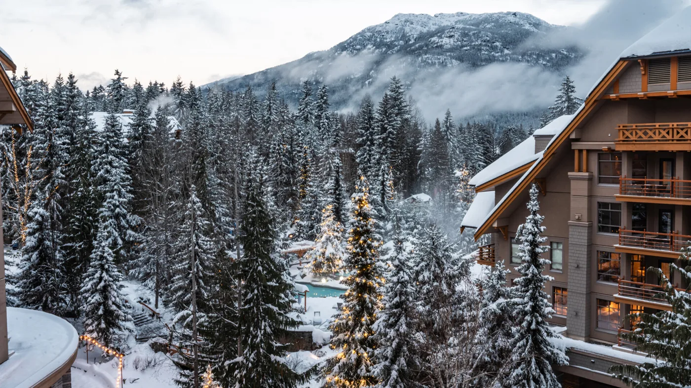 Four Seasons Resort Whistler and its outdoor pool surrounded by snow