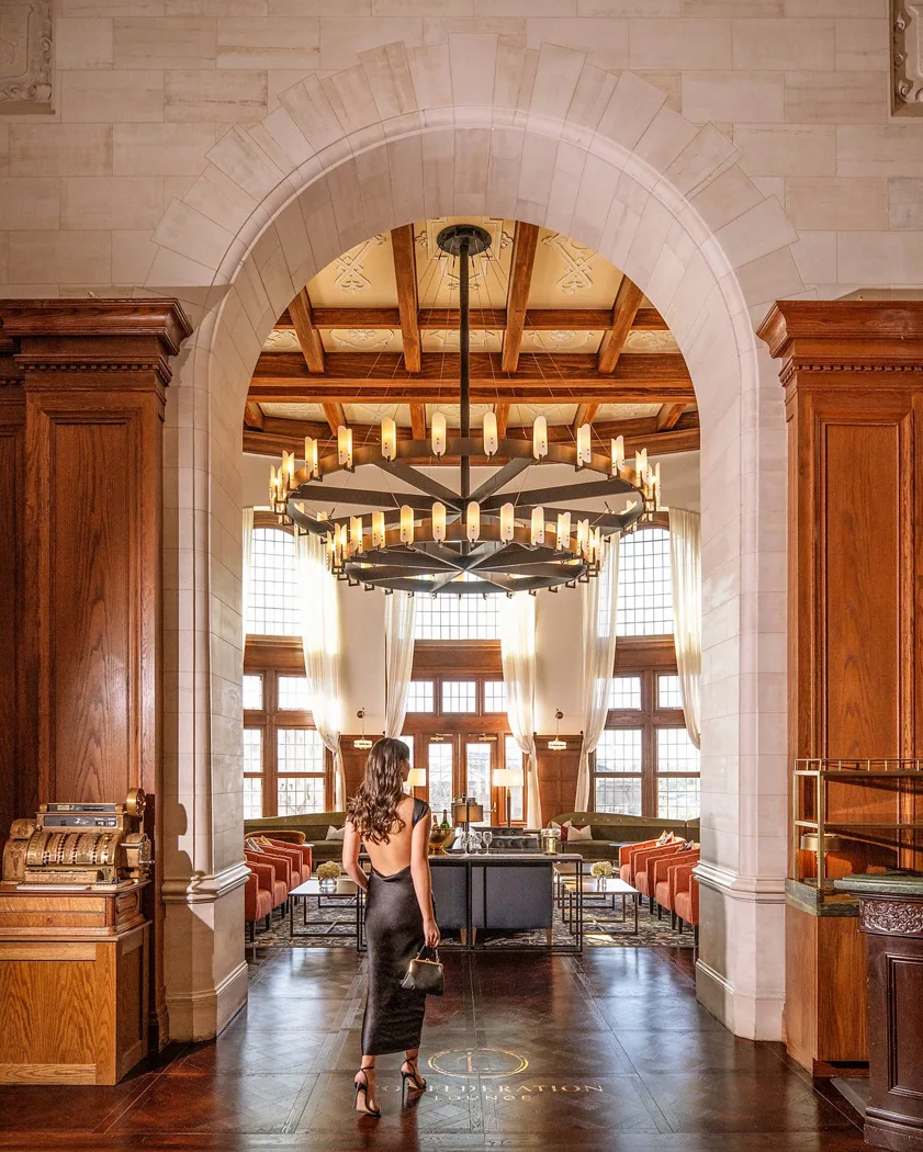 Arched doorway, chandelier and marble columns inside Fairmont Hotel Macdonald
