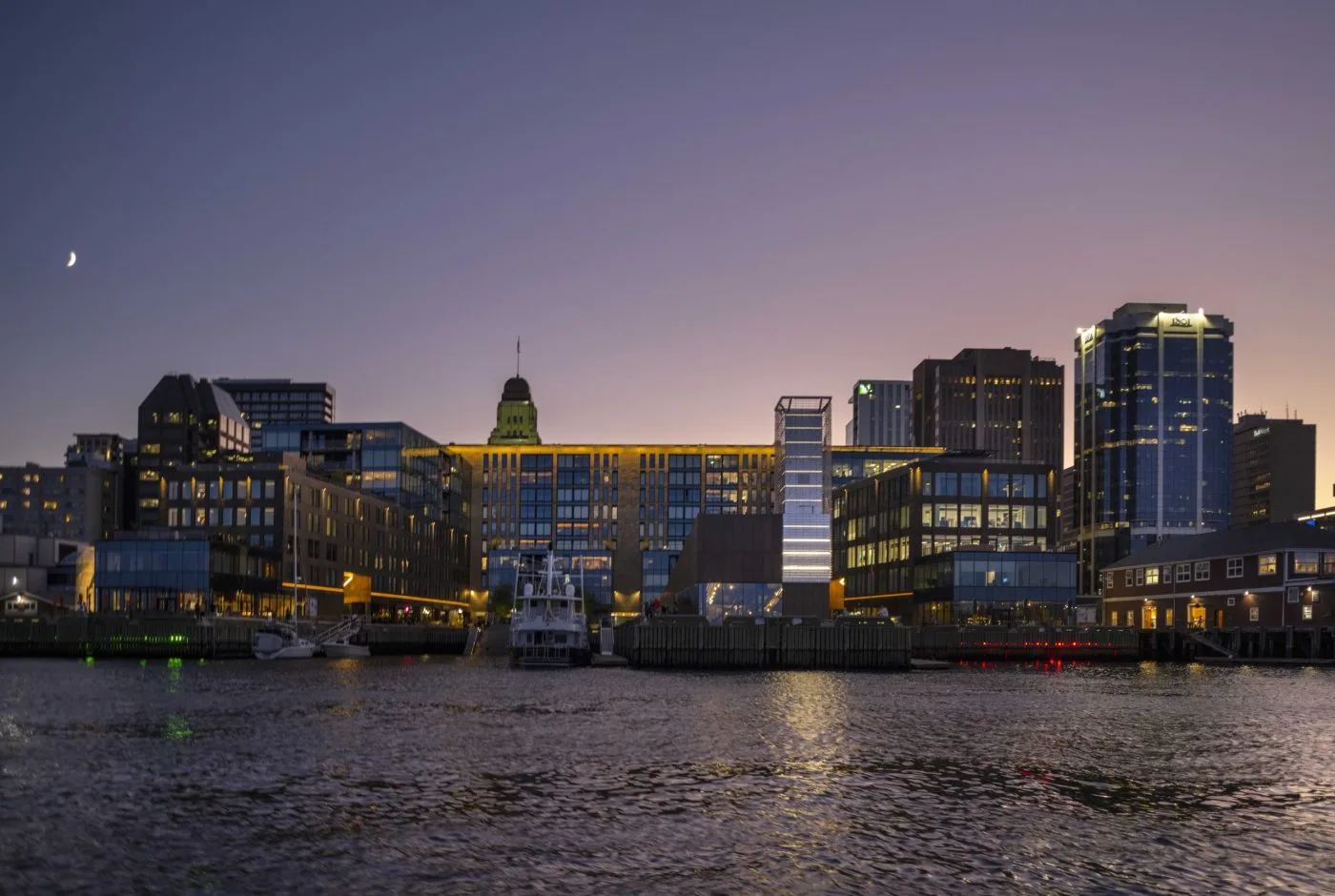 Muir and the Halifax waterfront lit up at dusk