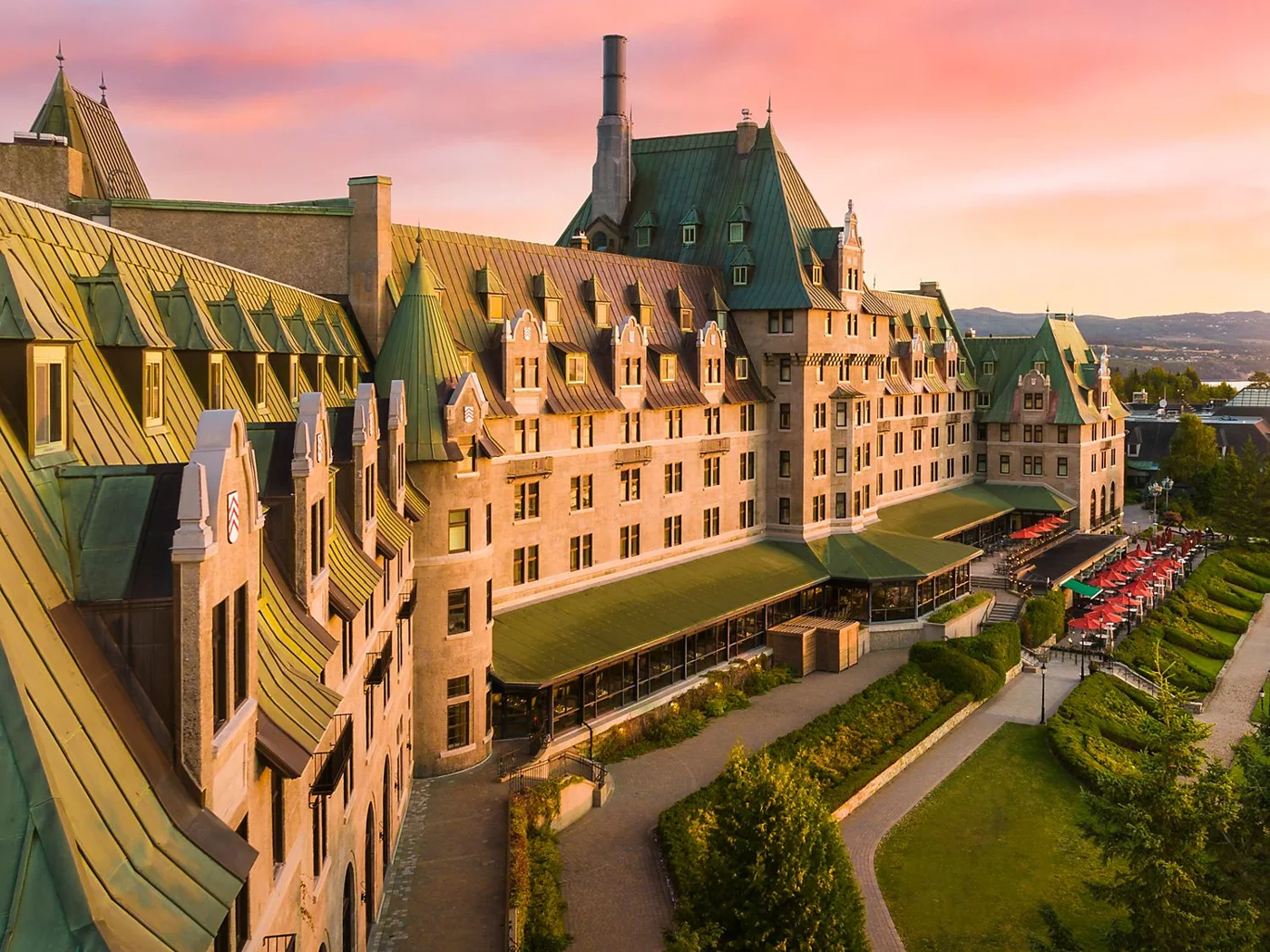 Fairmont Le Manoir Richelieu and its green roofs in warm sunset light