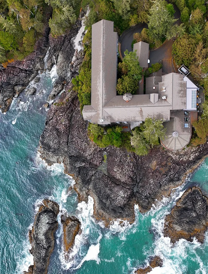 Aerial view of the Wickaninnish Inn on the rocky Pacific shoreline