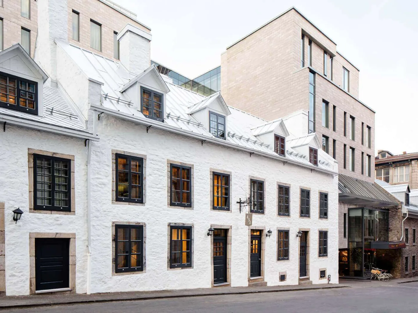 The pale historic facade and modern upper floors of Hotel William Gray