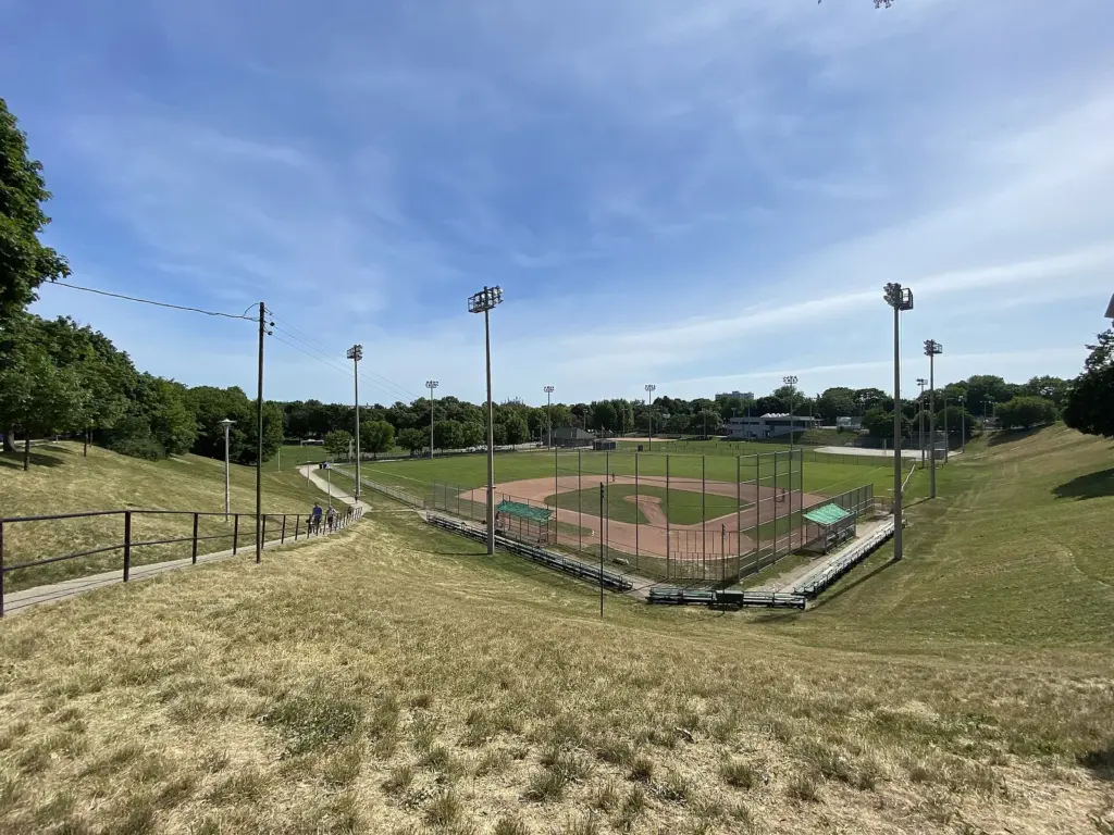 Dominico Field and the grassy slopes at Christie Pits Park in Toronto