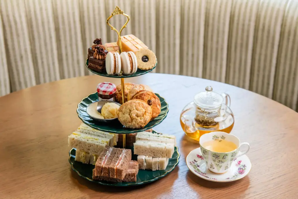 Sandwiches, scones, macarons and pastries on a tiered stand at The Dorset