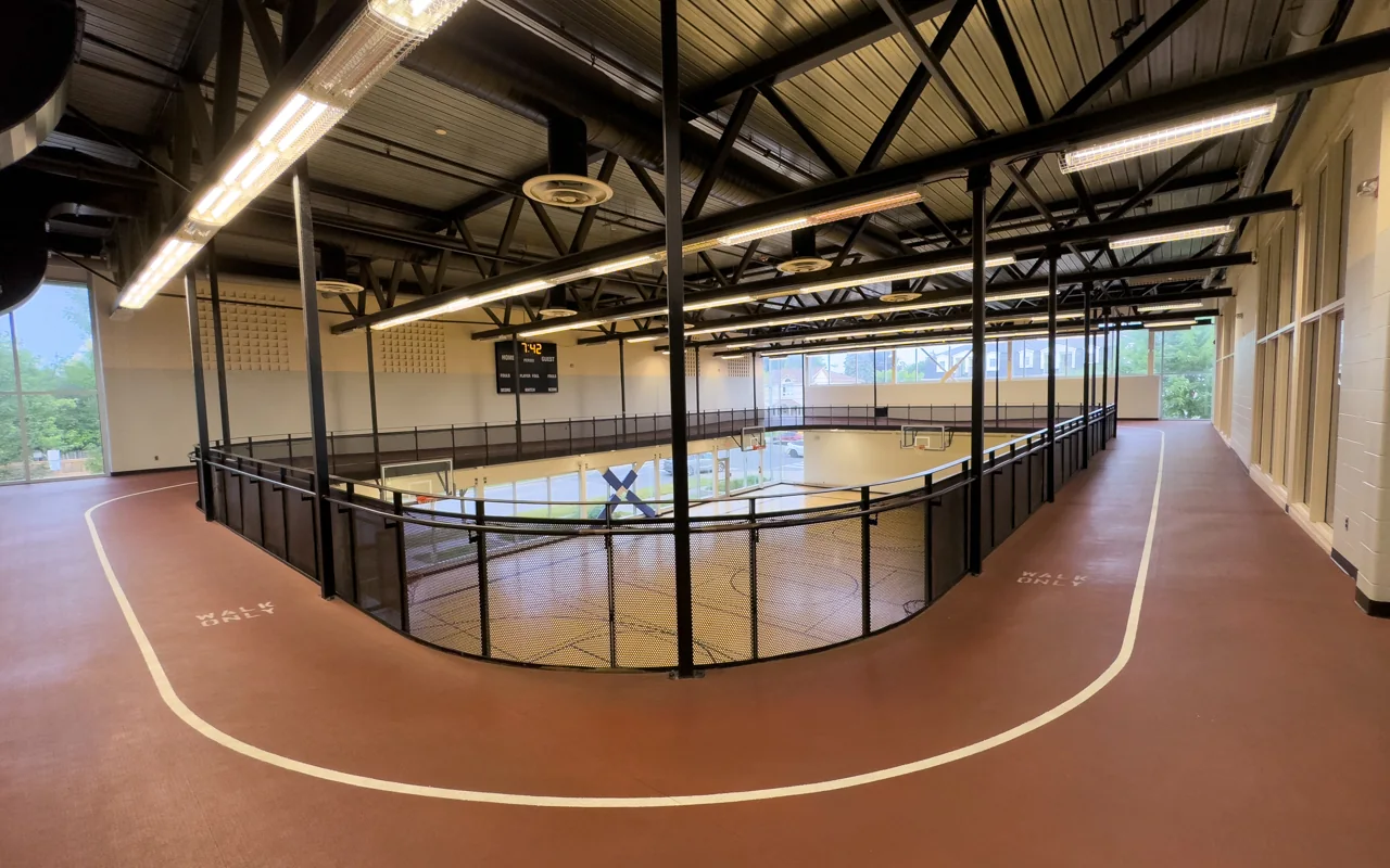 The indoor walking track curves above the gym at Edithvale Community Centre.