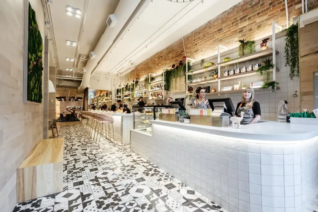 Bright Fresh Kitchen and Juice Bar dining room with tile floor and plants in Toronto