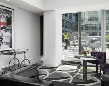 Bisha Marilyn Suite with a sofa and view onto a furnished patio