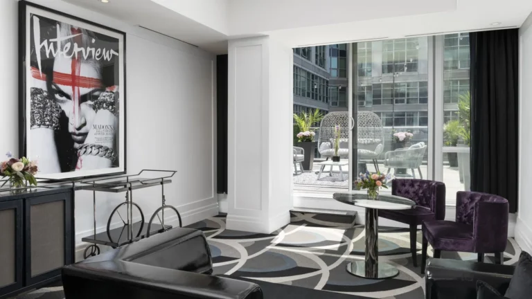 Bisha Marilyn Suite with a sofa and view onto a furnished patio