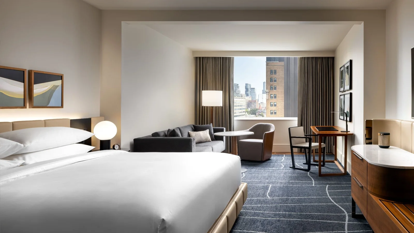 A Park Hyatt Toronto room with a king bed and sitting area