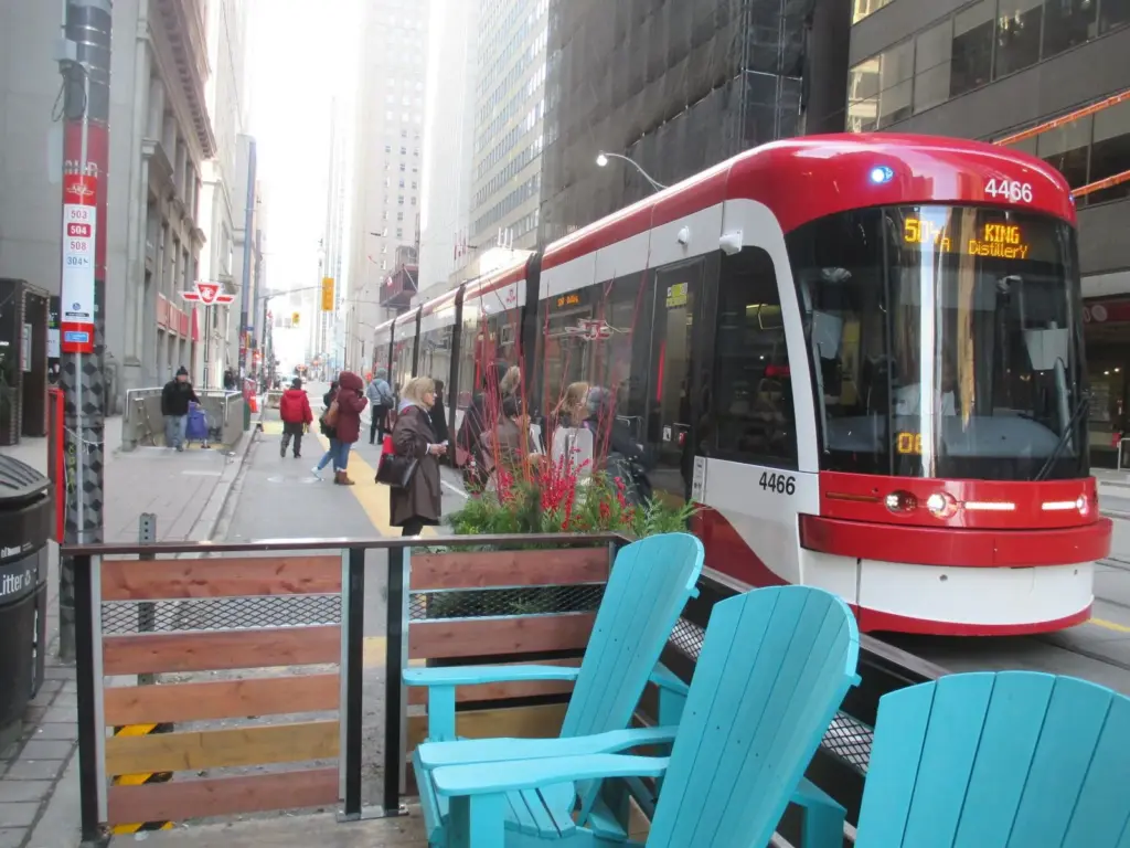 TTC streetcars moving along King Street in downtown Toronto