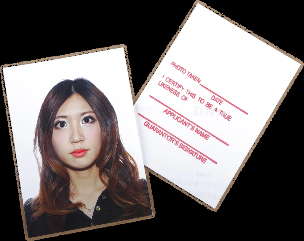 A sample printed passport photo beside its stamped reverse