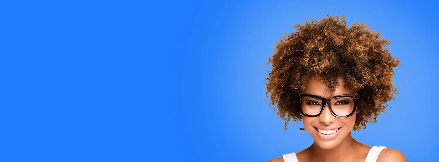 A woman wearing black glasses against a blue background