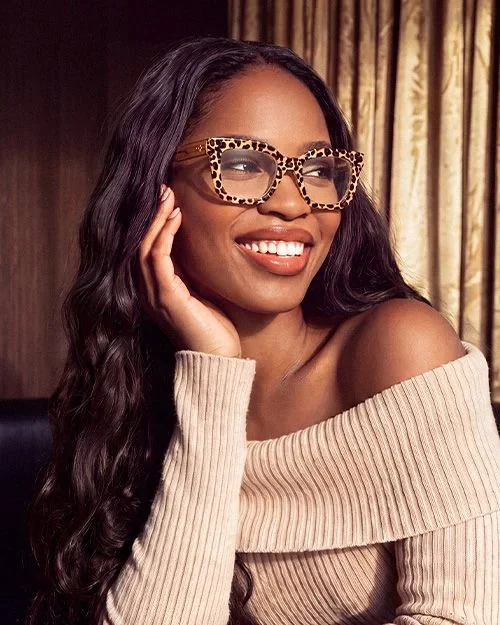 A woman wearing patterned statement frames from ZEELOOL
