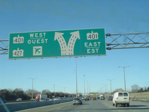 Traffic approaching signs for Highway 401 and Highway 427