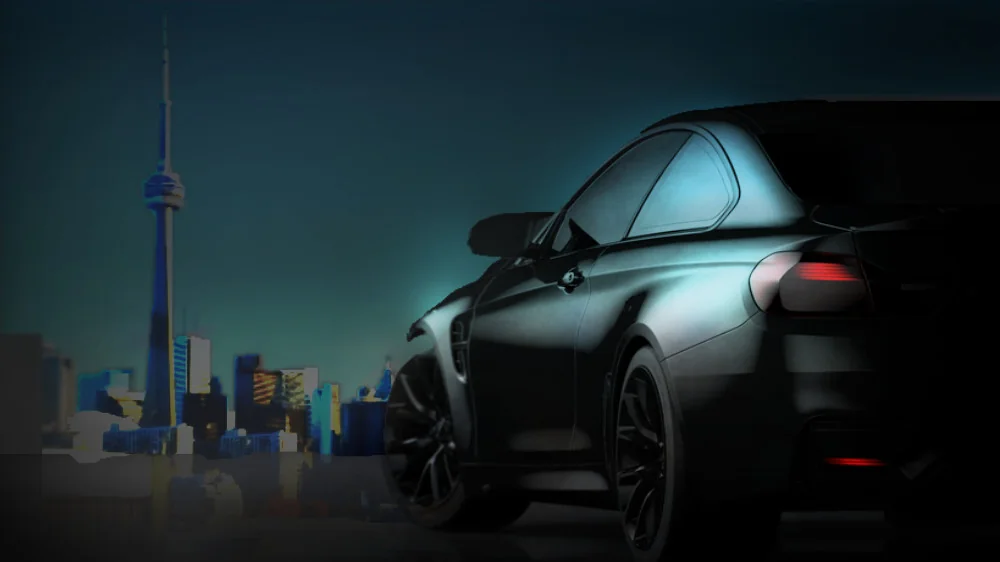 A Shifters car with the CN Tower in the background