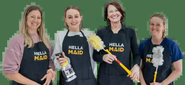 Four Hellamaid team members wearing branded aprons.