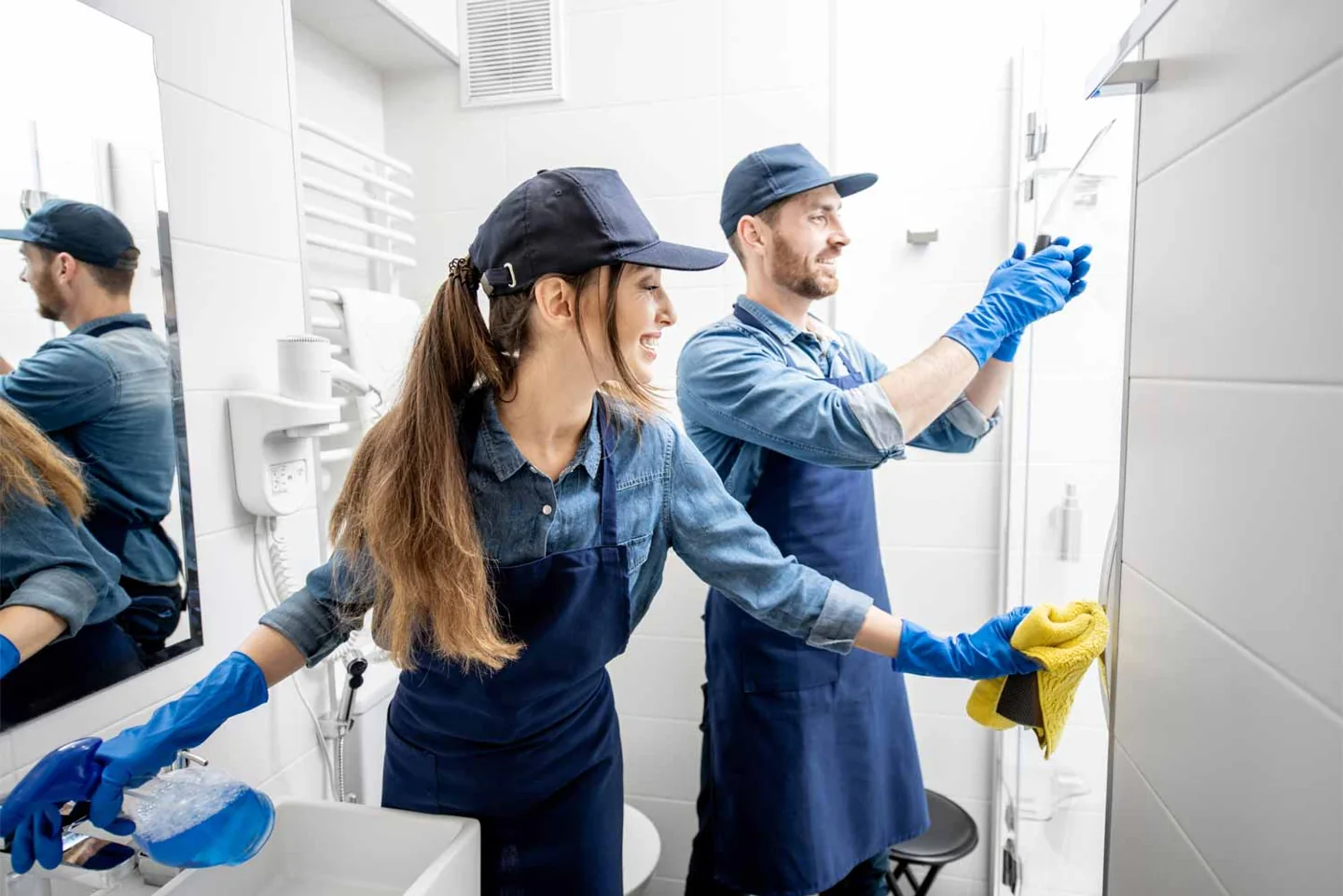 A cleaning team wiping a kitchen surface in a No More Chores photograph
