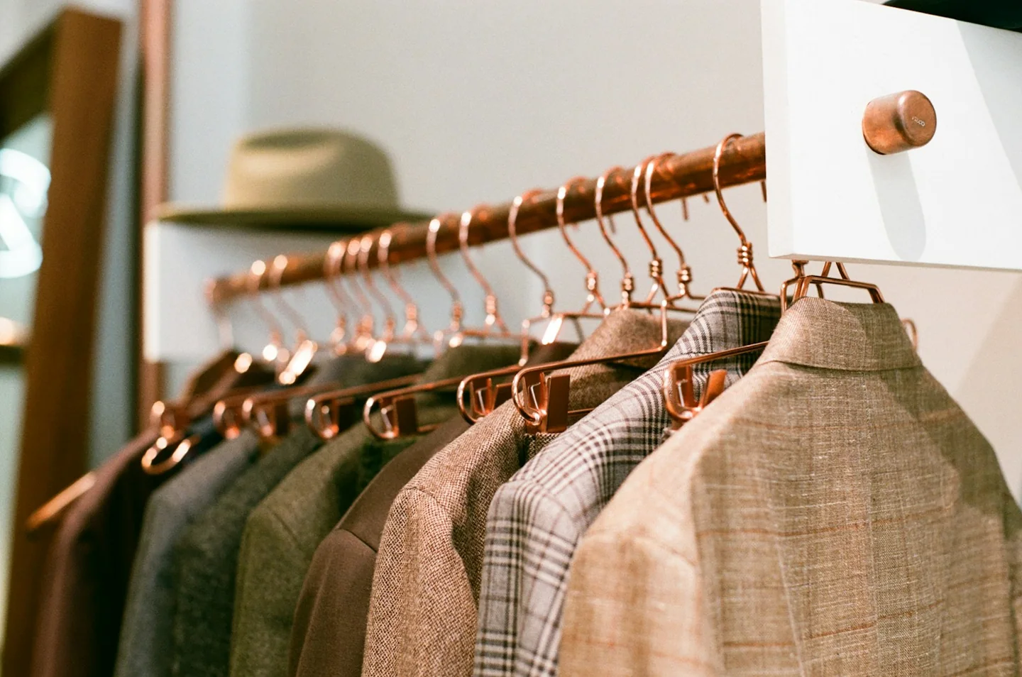 Clothing hanging on a shop rail