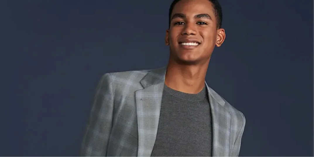 A model wearing a checked jacket shown by Moores