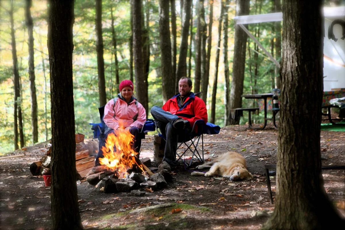 Campers sitting around a fire at Silent Lake