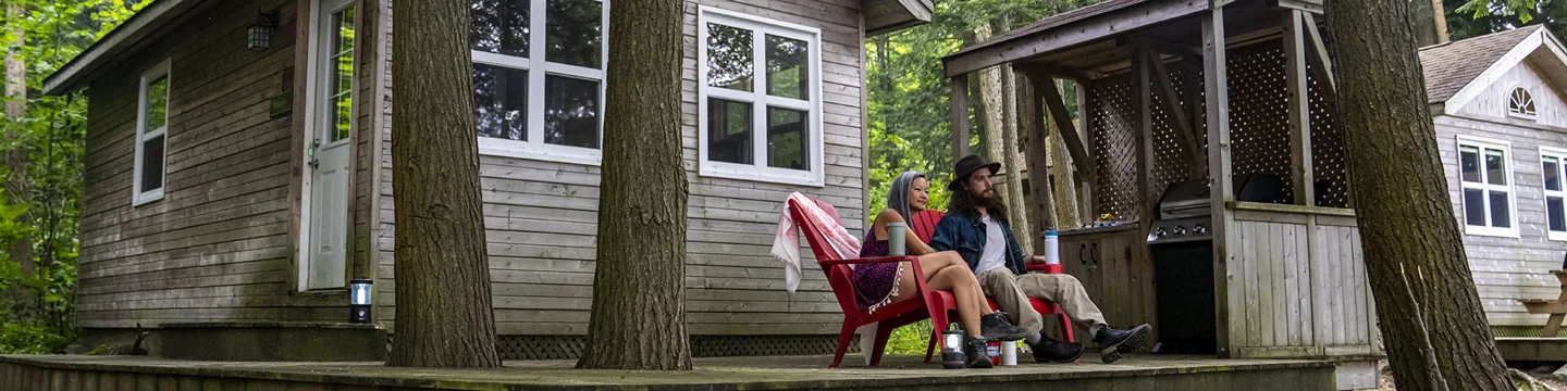 Visitors outside a cabin on Beausoleil Island