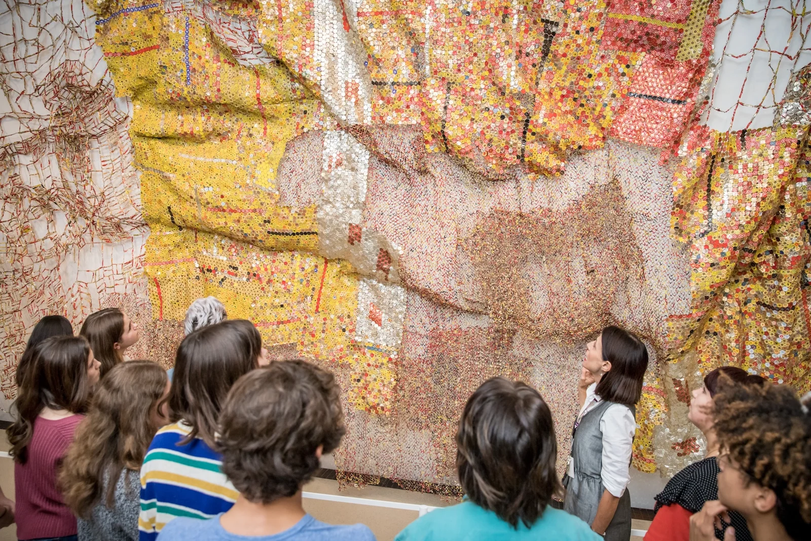 A group studying a large wall mosaic at ROM