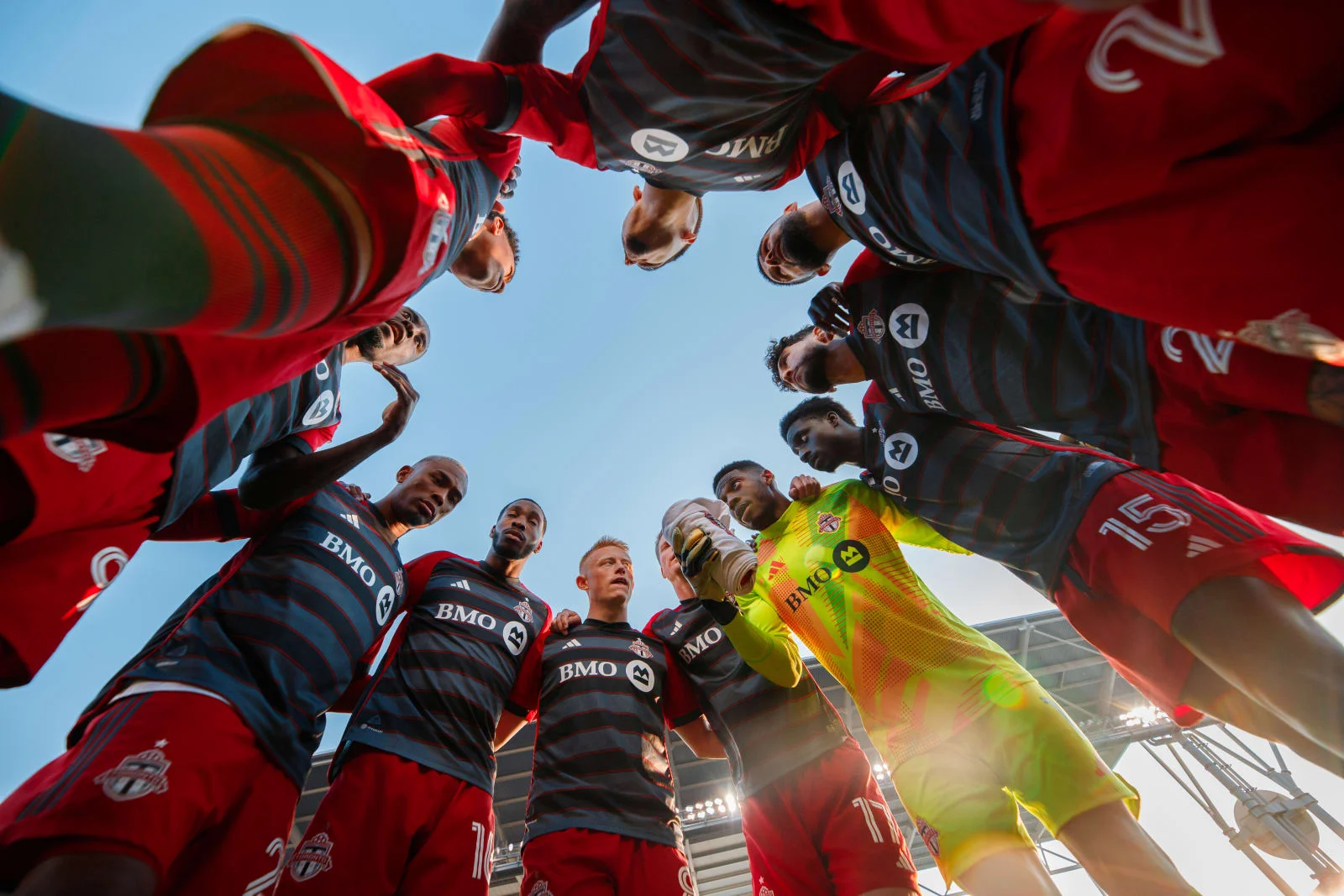 Toronto FC players gathered in a huddle before a match