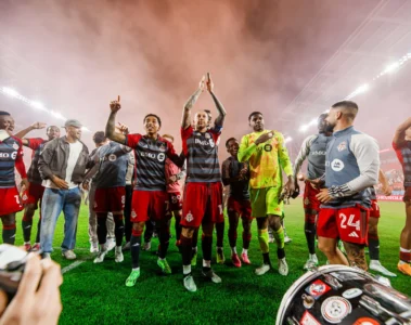 Toronto FC players celebrating with supporters at BMO Field