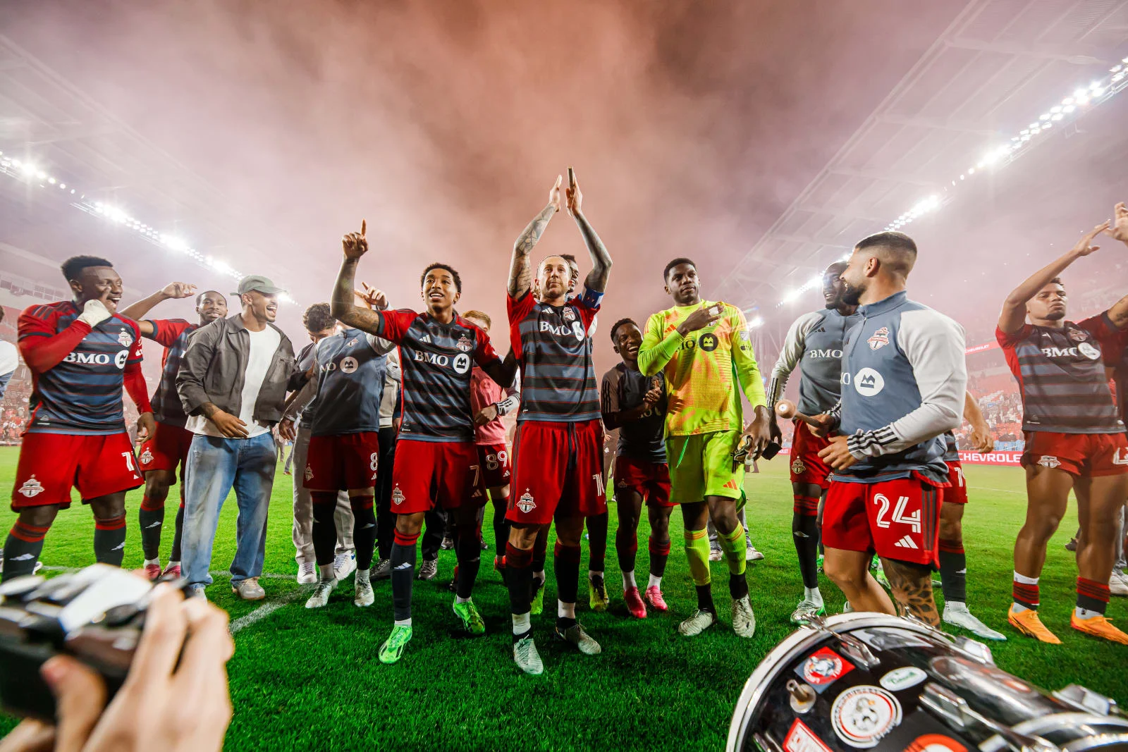 Toronto FC players celebrating with supporters at BMO Field