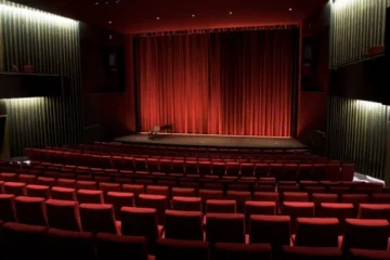 Rows of red cinema seats inside TIFF Lightbox
