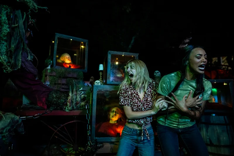 Visitors reacting to a performer at Halloween Haunt