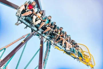 Riders on an inverted roller coaster at Canada’s Wonderland