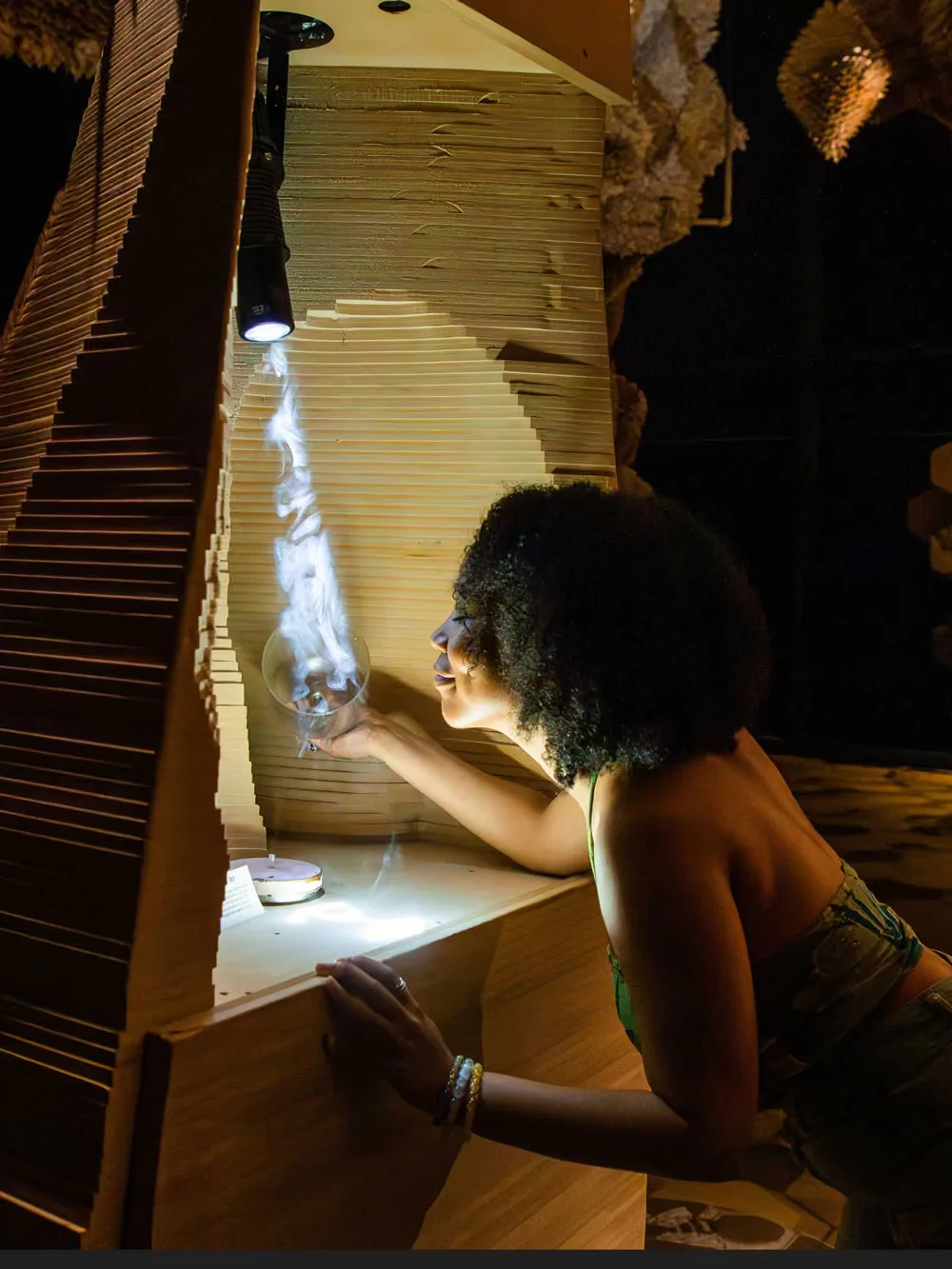 A visitor looking closely at an Arcadia Earth installation