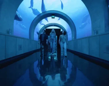 Visitors in a blue-lit room at Arcadia Earth Toronto