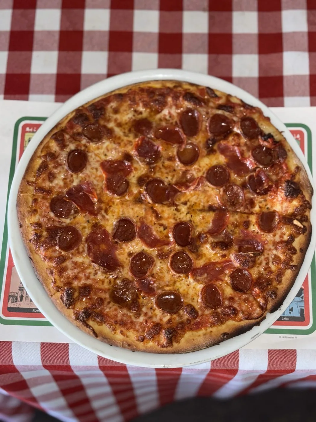 Pizza on a checked tablecloth at Casa di Giorgio