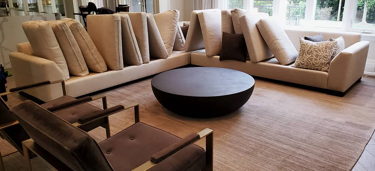 A furnished living room shown on New Age’s cleaning website