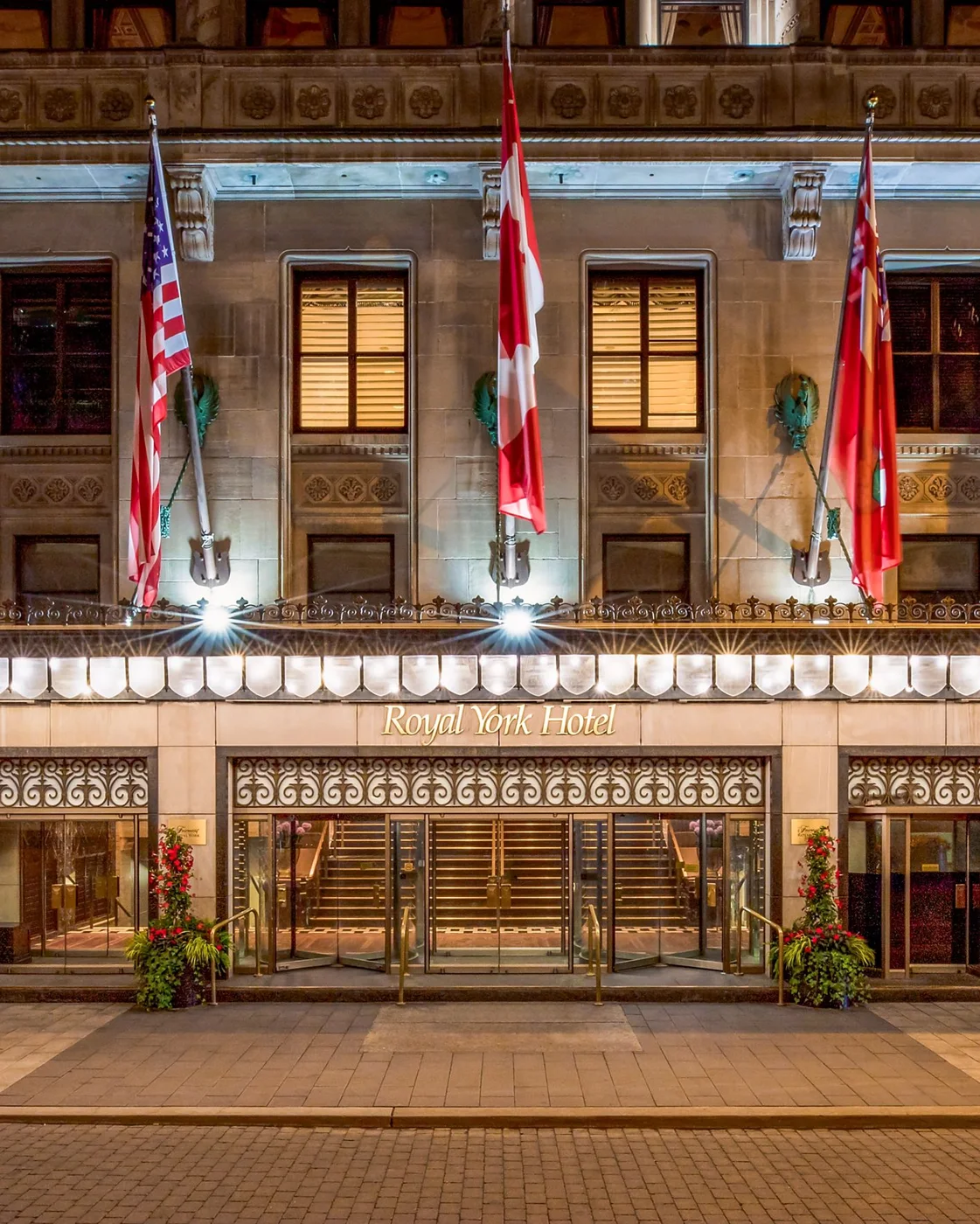 Illuminated entrance to Fairmont Royal York on Front Street