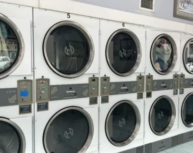 Stacked dryers inside Washworld Coin Laundry
