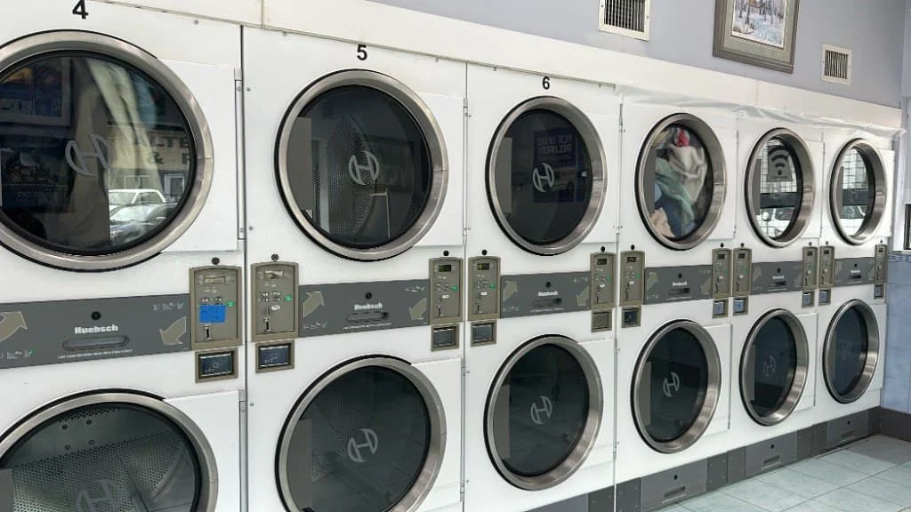 Stacked dryers inside Washworld Coin Laundry
