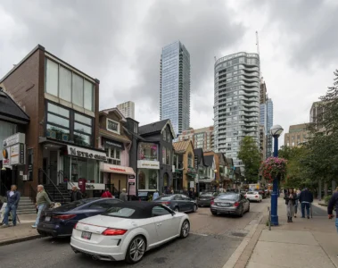People and shops on a Yorkville street in September 2026