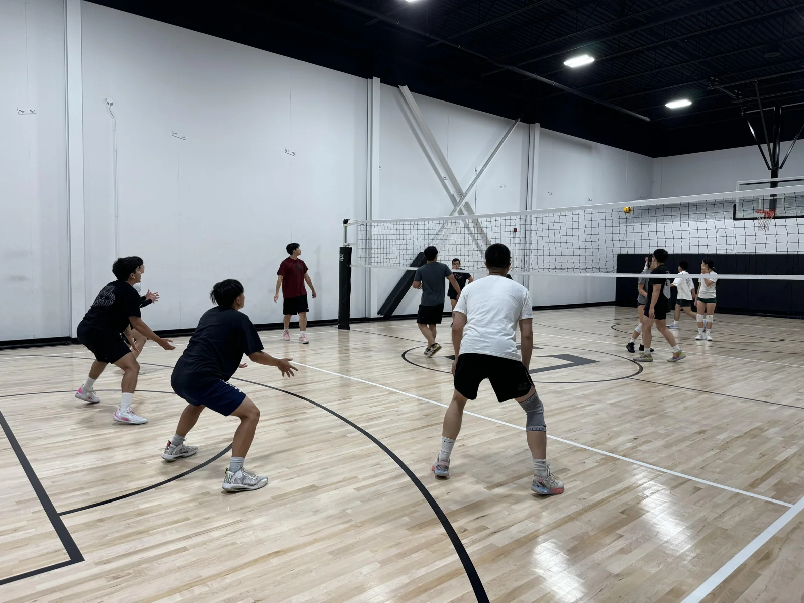 Players at an indoor Javelin volleyball session