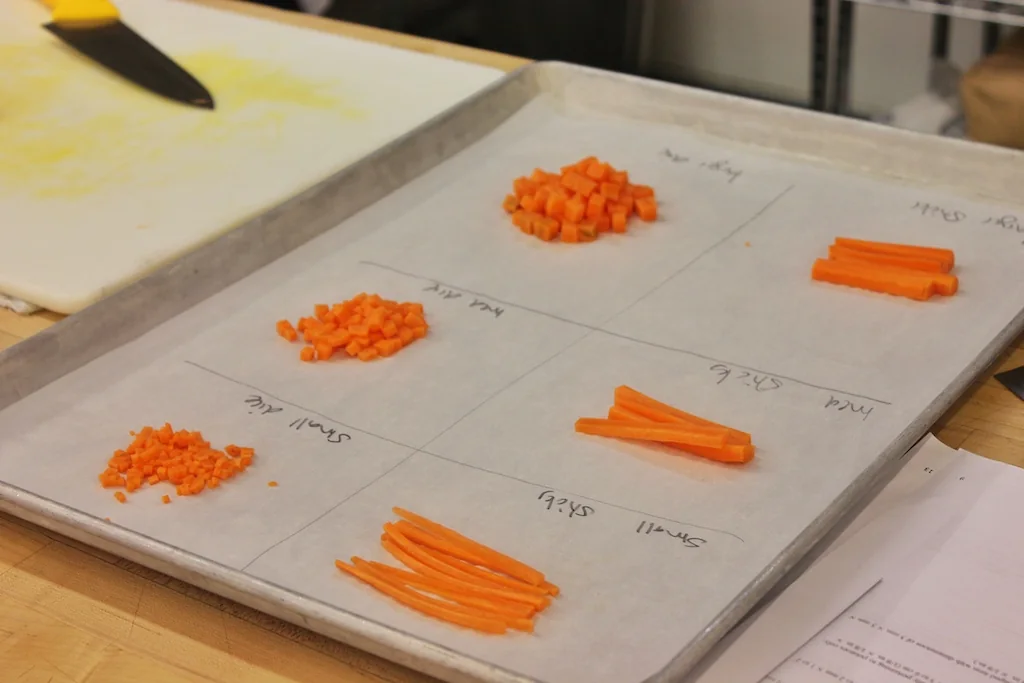Different cuts of carrot arranged on a teaching tray at George Brown