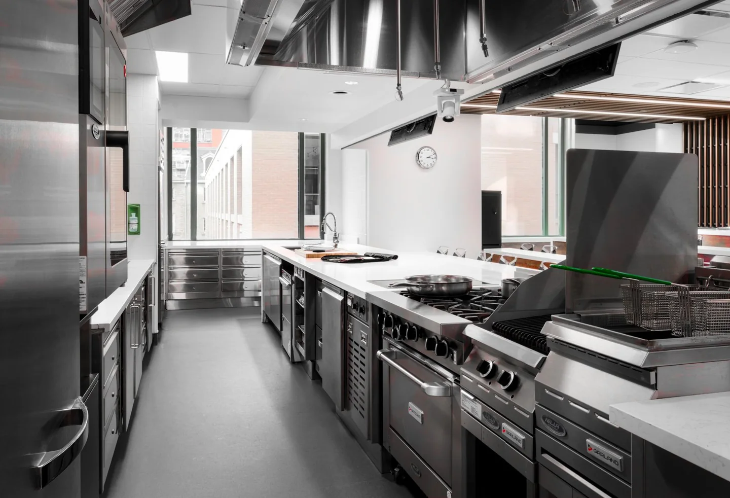Stoves and stainless-steel work surfaces in a George Brown culinary teaching kitchen