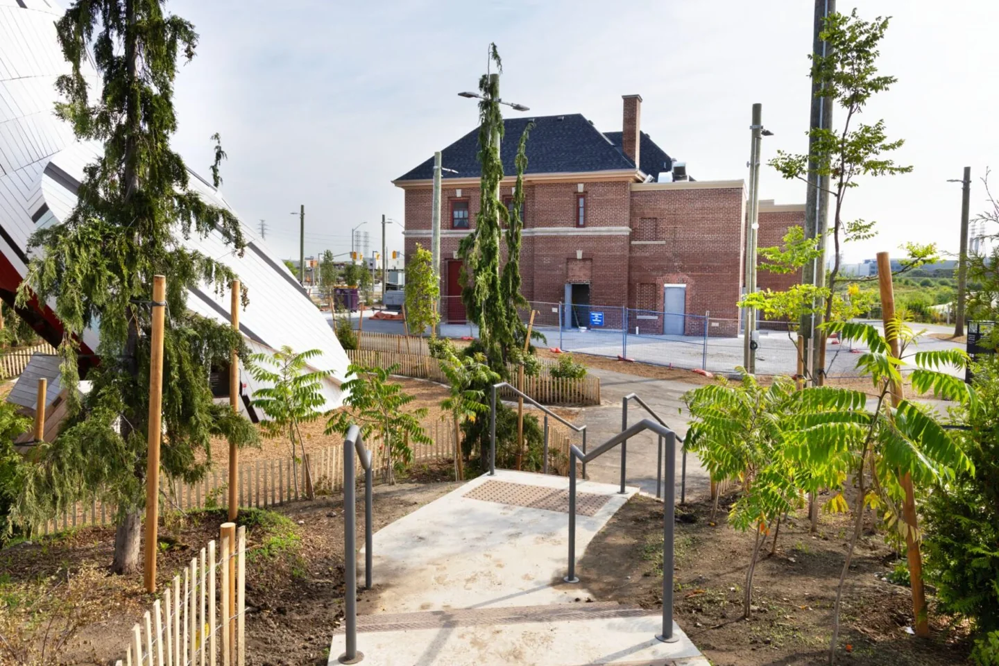 A stepped path with wooden handrails near the fire hall