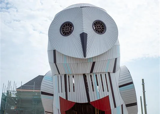 A white owl-shaped climbing structure in Biidaasige Park